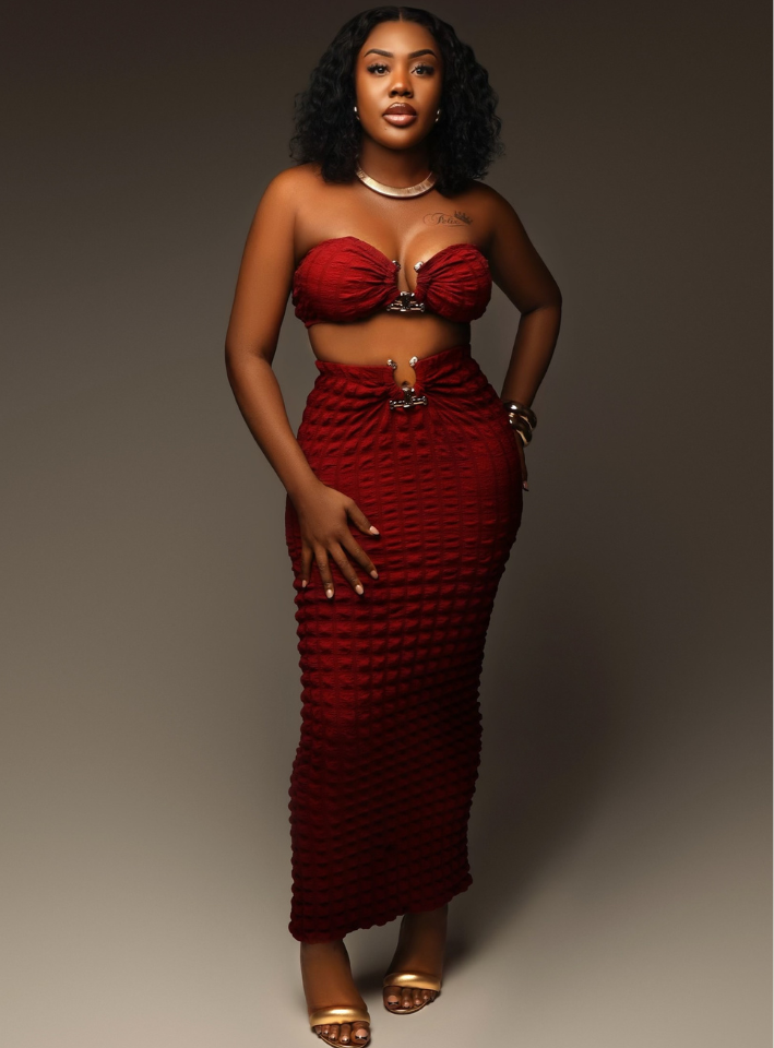 Elegant bandeau top paired with a stylish skirt, perfect for sophisticated and modern fashion ensembles.